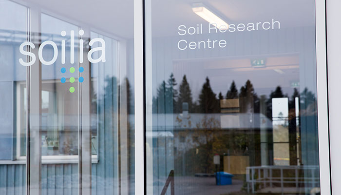 A close-up of the glass window of the Soilia research center.