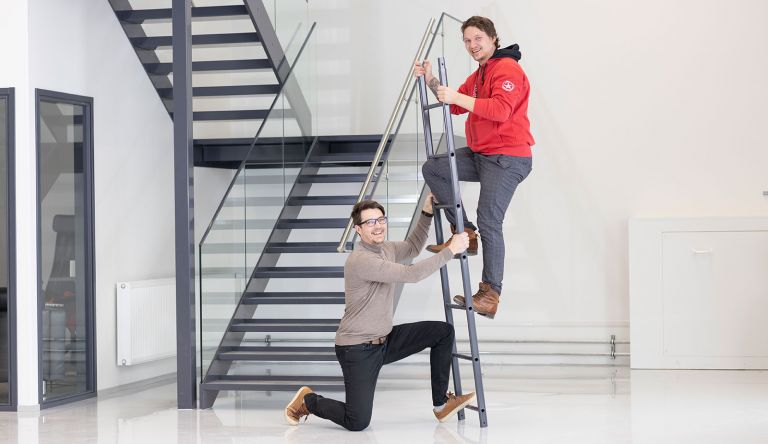Sadex's Teemu Kokki climbs the ladder that Sadex's sales director Ville Kukkonen is holding up.